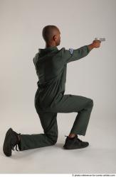 ERIC KNEELING POSE WITH GUNS